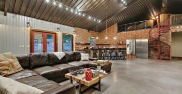 Barn house interior photography, leather sofa, spiral stair, bar table, steel roof, wooden center table,
